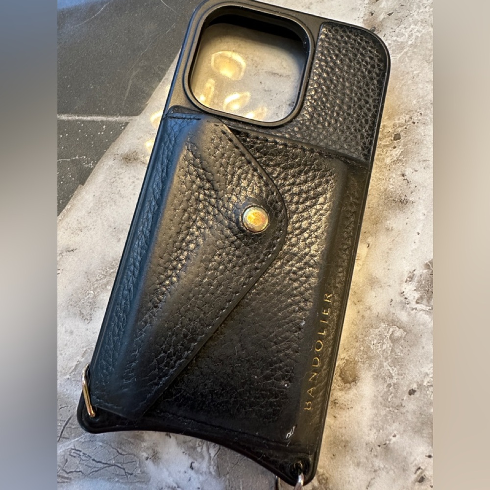 Bandolier Black Leather Phone Case with adjustable and removable strap.